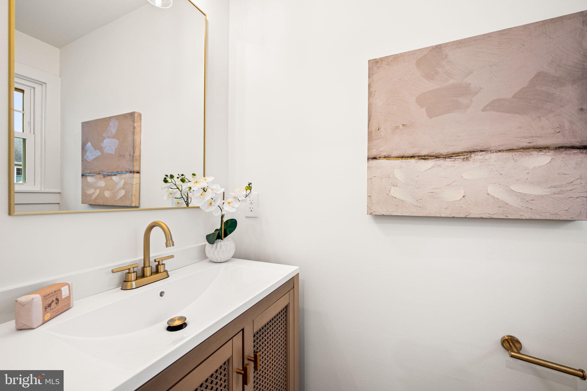 323 Sagamore Road Havertown, PA 19083 - Photo 14 of 32 a bathroom with a sink and a mirror