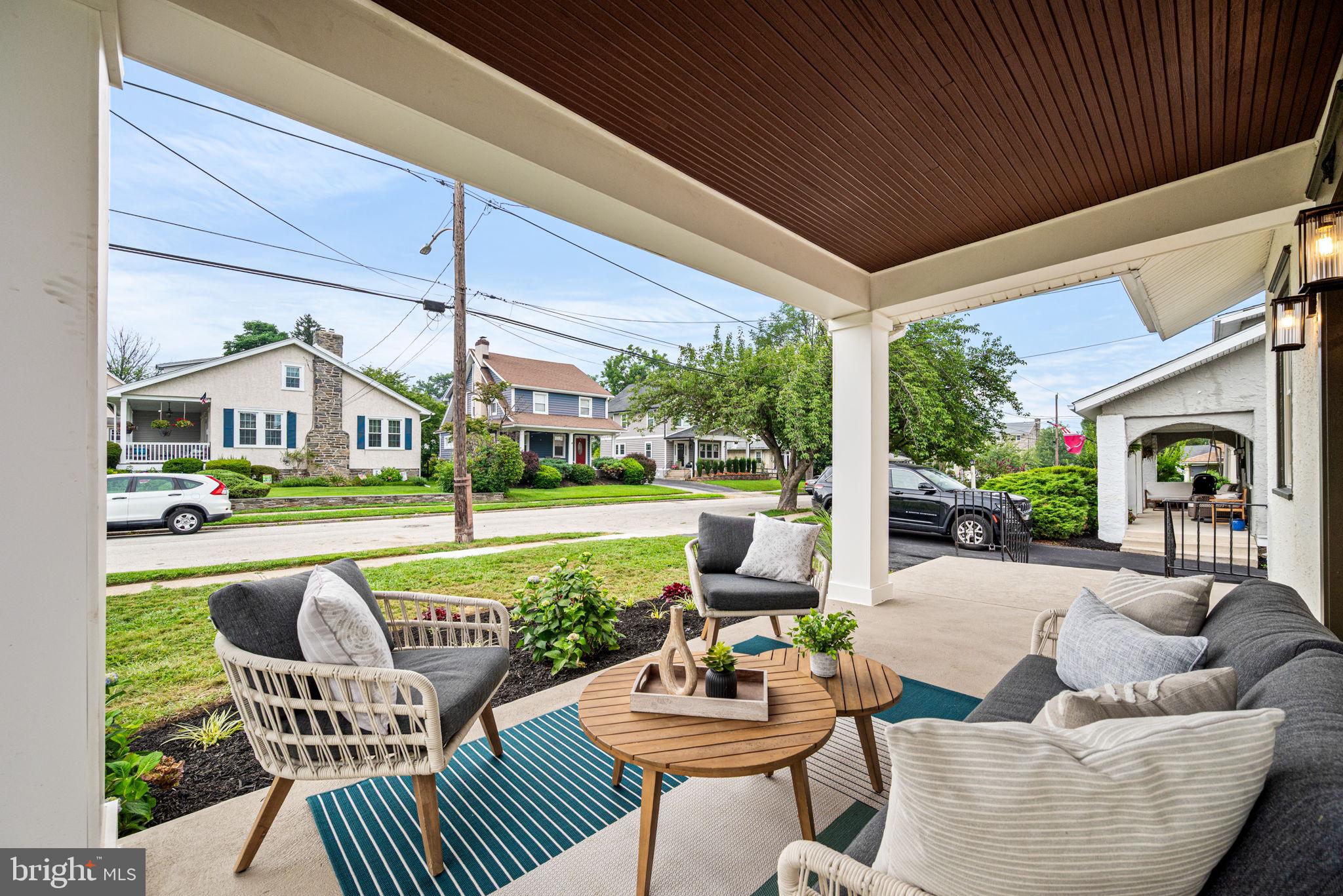 323 Sagamore Road Havertown, PA 19083 - Photo 3 of 32 a view of a patio with couches chairs and a yard