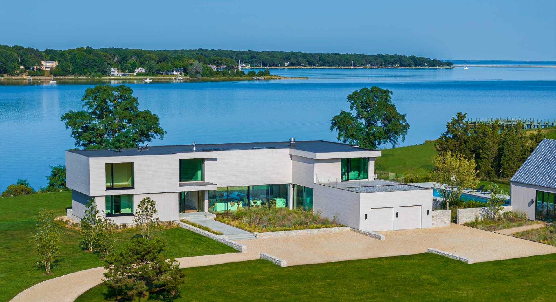 an aerial view of house with yard and lake view