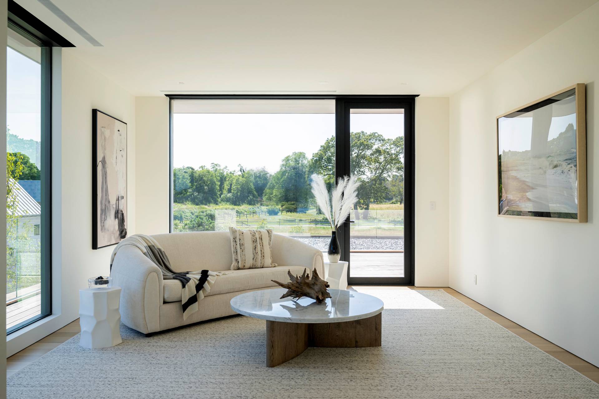 1 Pandion Road Shelter Island, NY 11964 - Photo 18 of 32 a living room with furniture and a large window