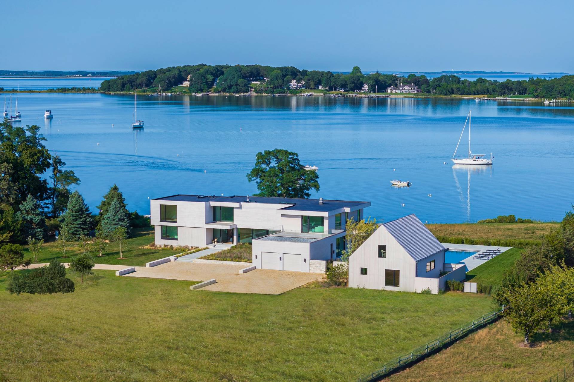 1 Pandion Road Shelter Island, NY 11964 - Photo 29 of 32 a front view of a house with a yard