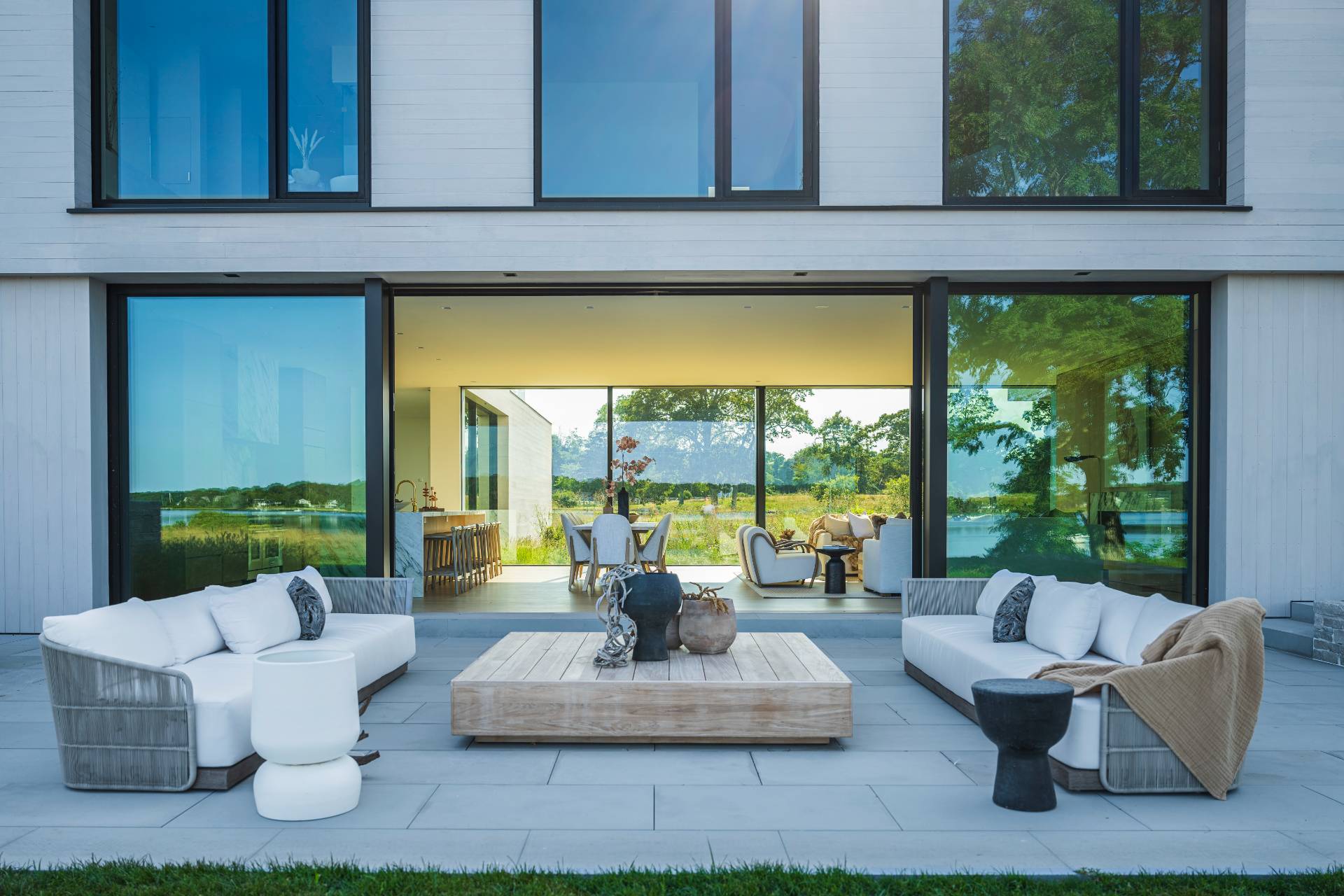 1 Pandion Road Shelter Island, NY 11964 - Photo 9 of 32 a living room with patio furniture and a potted plant