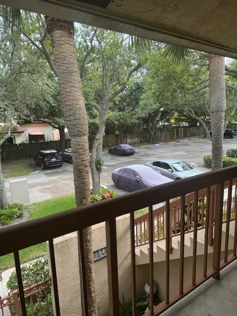 3939 Northeast 5th Avenue, Unit B203 Boca Raton, FL 33431 - Photo 11 of 15 a view of balcony with furniture and garden