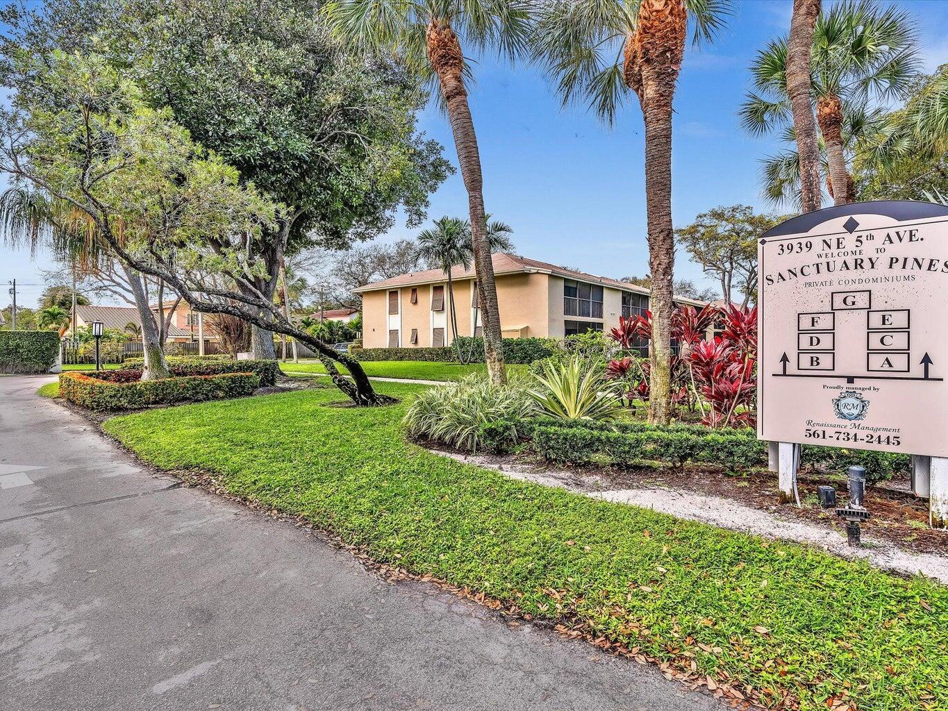 3939 Northeast 5th Avenue, Unit B203 Boca Raton, FL 33431 - Photo 2 of 15 a view of house with outdoor space and garden