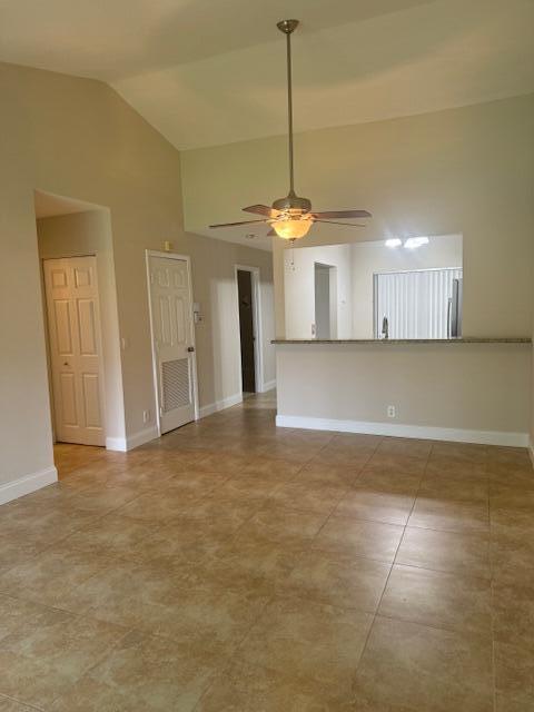 3939 Northeast 5th Avenue, Unit B203 Boca Raton, FL 33431 - Photo 5 of 15 a view of a kitchen with a sink and a chandelier