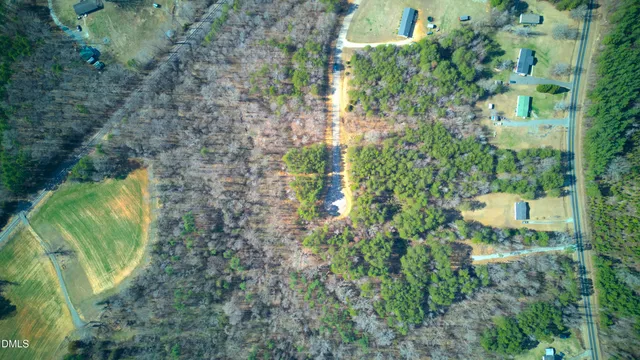 a backyard of a house with lots of green space and trees