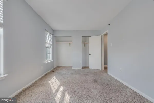 a view of an empty room and a window