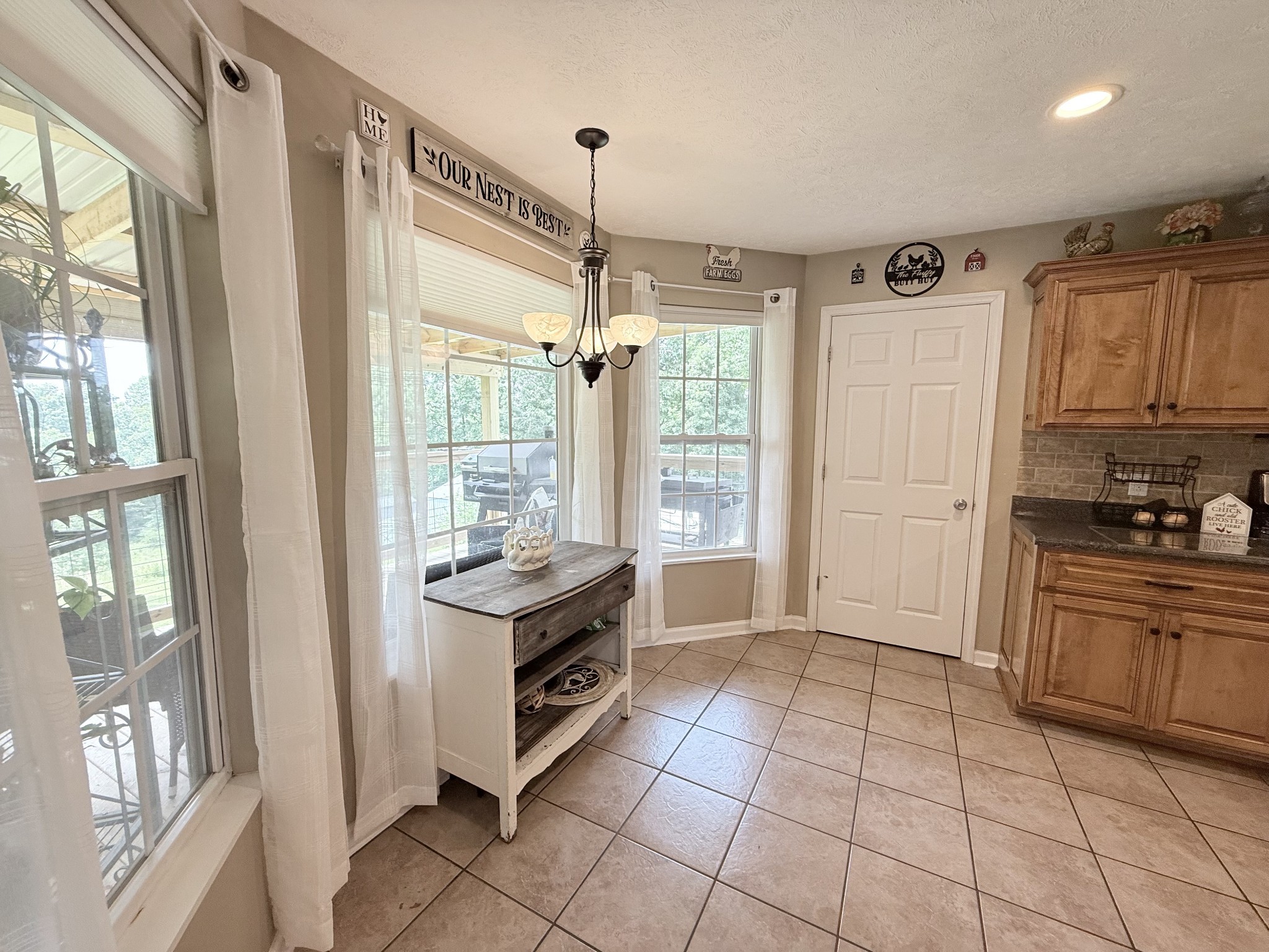 1479 Mt Vernon Road Bethpage, TN 37022 - Photo 11 of 39 a kitchen with granite countertop a stove top oven sink and cabinets