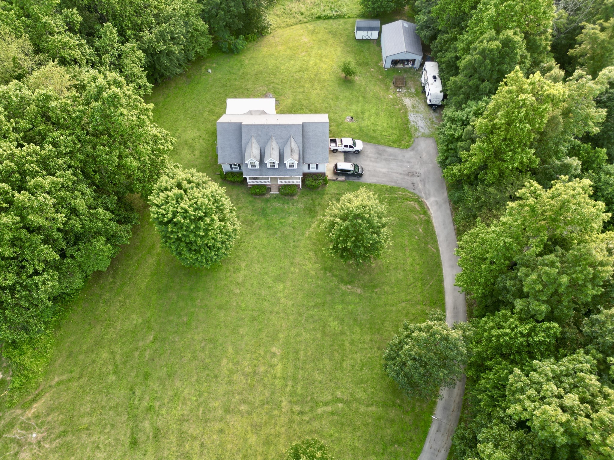 1479 Mt Vernon Road Bethpage, TN 37022 - Photo 39 of 39 a aerial view of a house with a yard basket ball court and outdoor seating