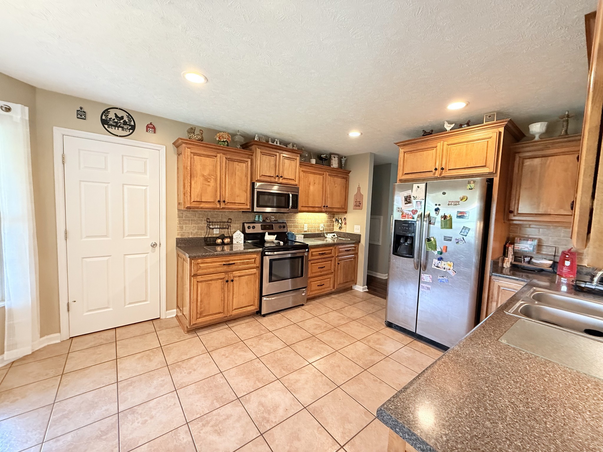 1479 Mt Vernon Road Bethpage, TN 37022 - Photo 9 of 39 a kitchen with stainless steel appliances a refrigerator and a stove top oven