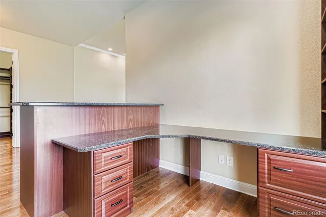 a view of cabinets and wooden floor