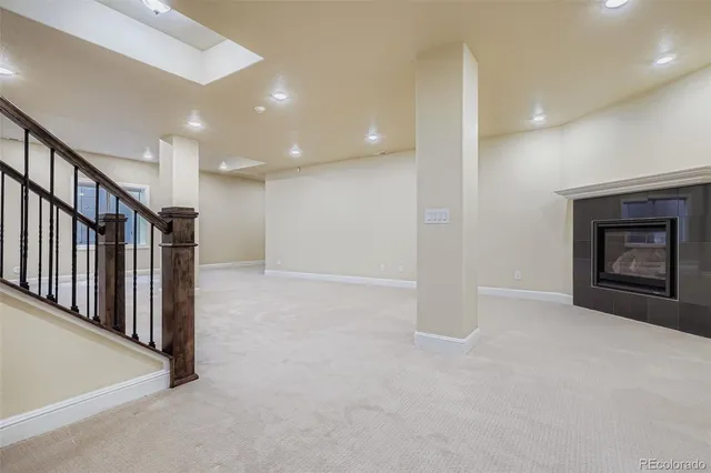 a view of an empty room with a fireplace