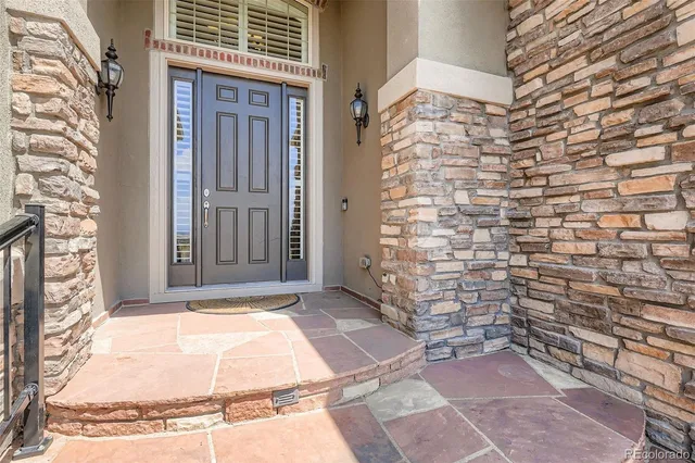 a view of a brick house with many windows