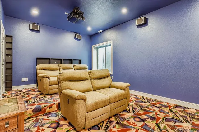 a bedroom with furniture and a rug