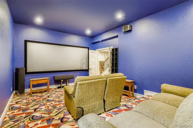 a bedroom with furniture and a flat screen tv