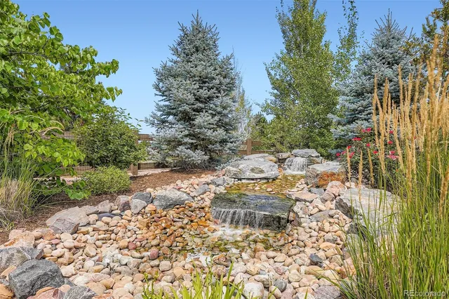 a front view of house with yard and seating area