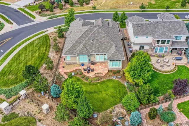 an aerial view of residential houses with outdoor space