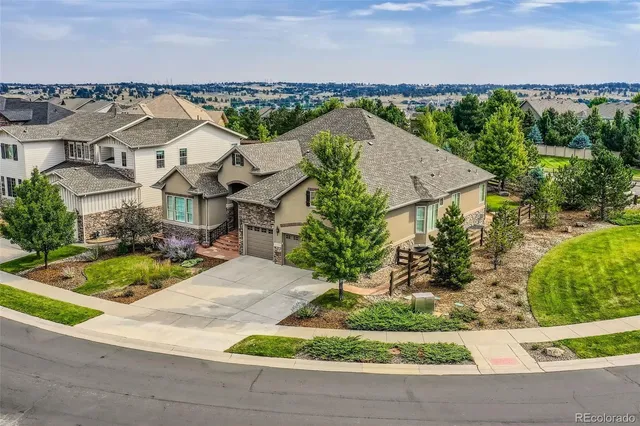 an aerial view of a city with a lake view