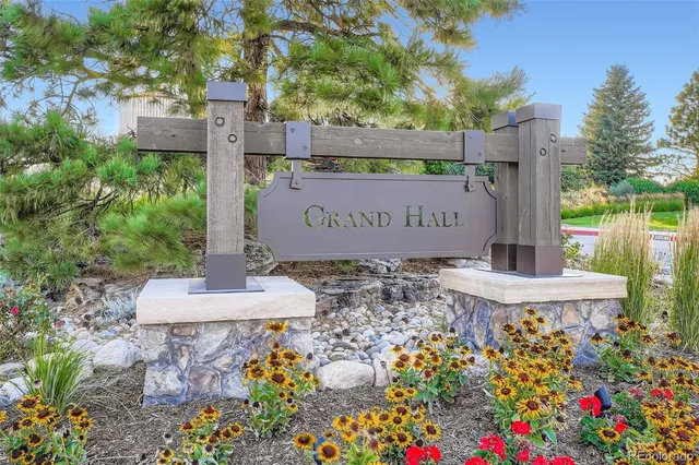 a front view of a house with a yard and a garage