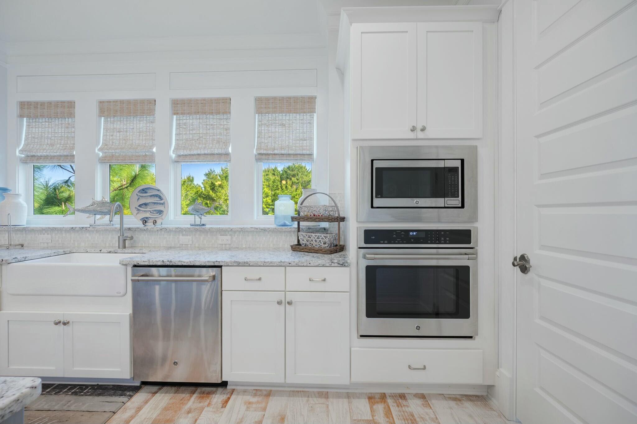 166 Clipper St Inlet Beach Inlet Beach, FL 32461 - Photo 15 of 71 a kitchen with stainless steel appliances a stove a sink and a microwave