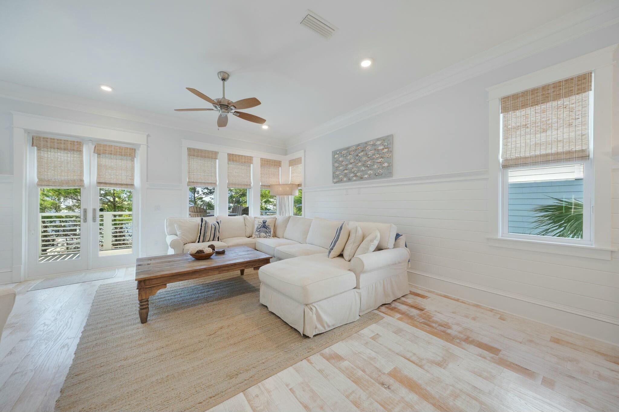 166 Clipper St Inlet Beach Inlet Beach, FL 32461 - Photo 28 of 71 a spacious bedroom with a large bed couch and a large window