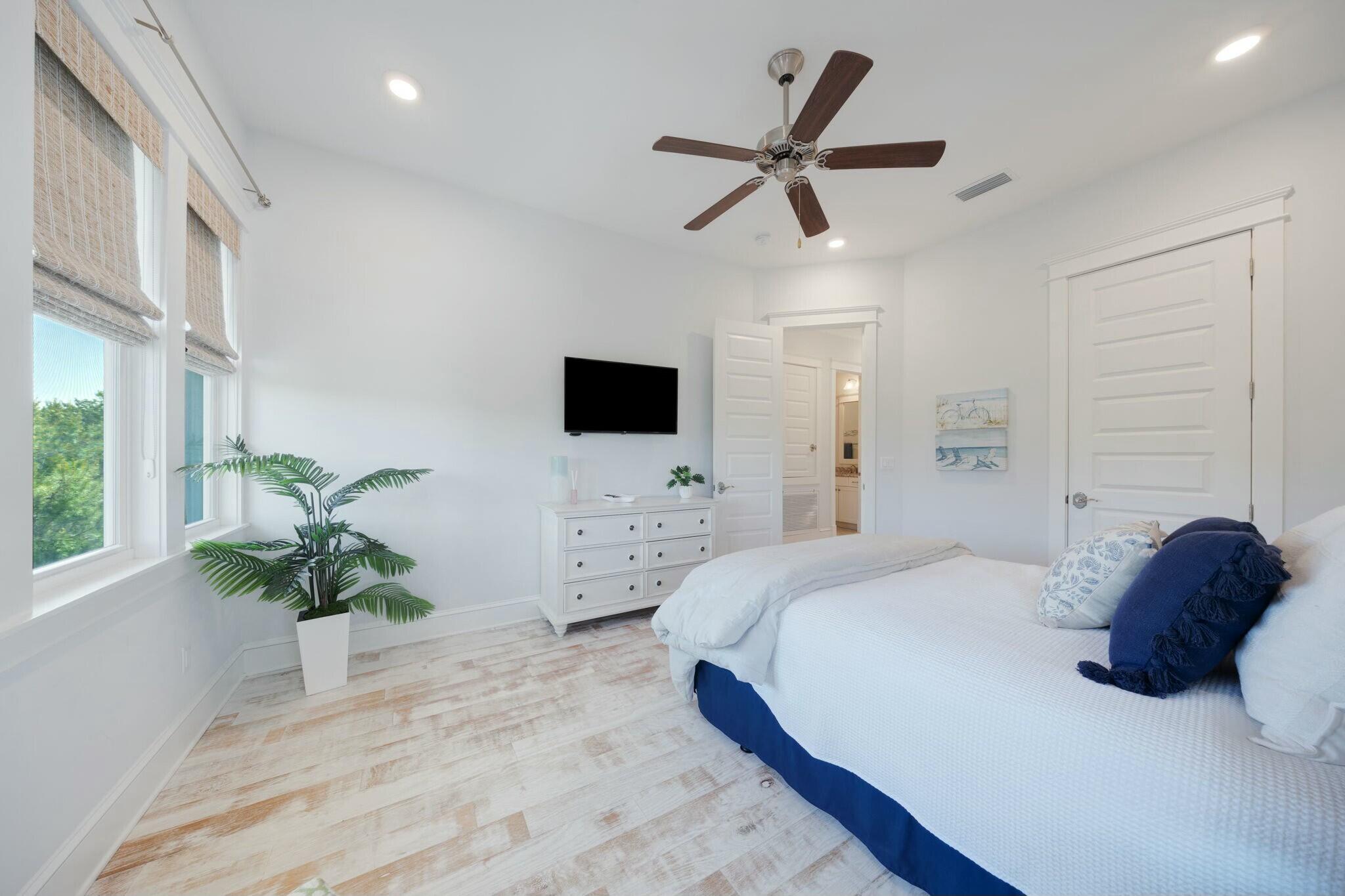 166 Clipper St Inlet Beach Inlet Beach, FL 32461 - Photo 33 of 71 a bedroom with a bed a window and a potted plant