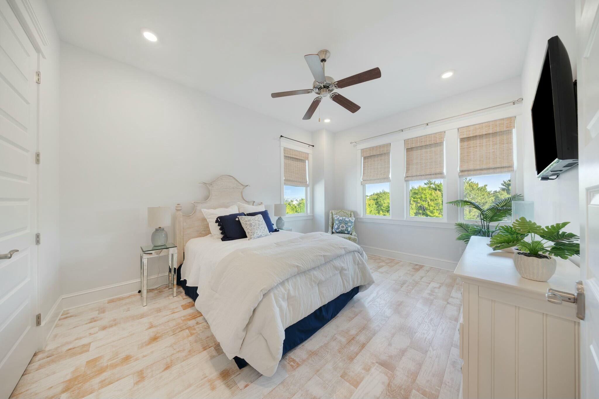 166 Clipper St Inlet Beach Inlet Beach, FL 32461 - Photo 34 of 71 a bedroom with a bed and a flat screen tv