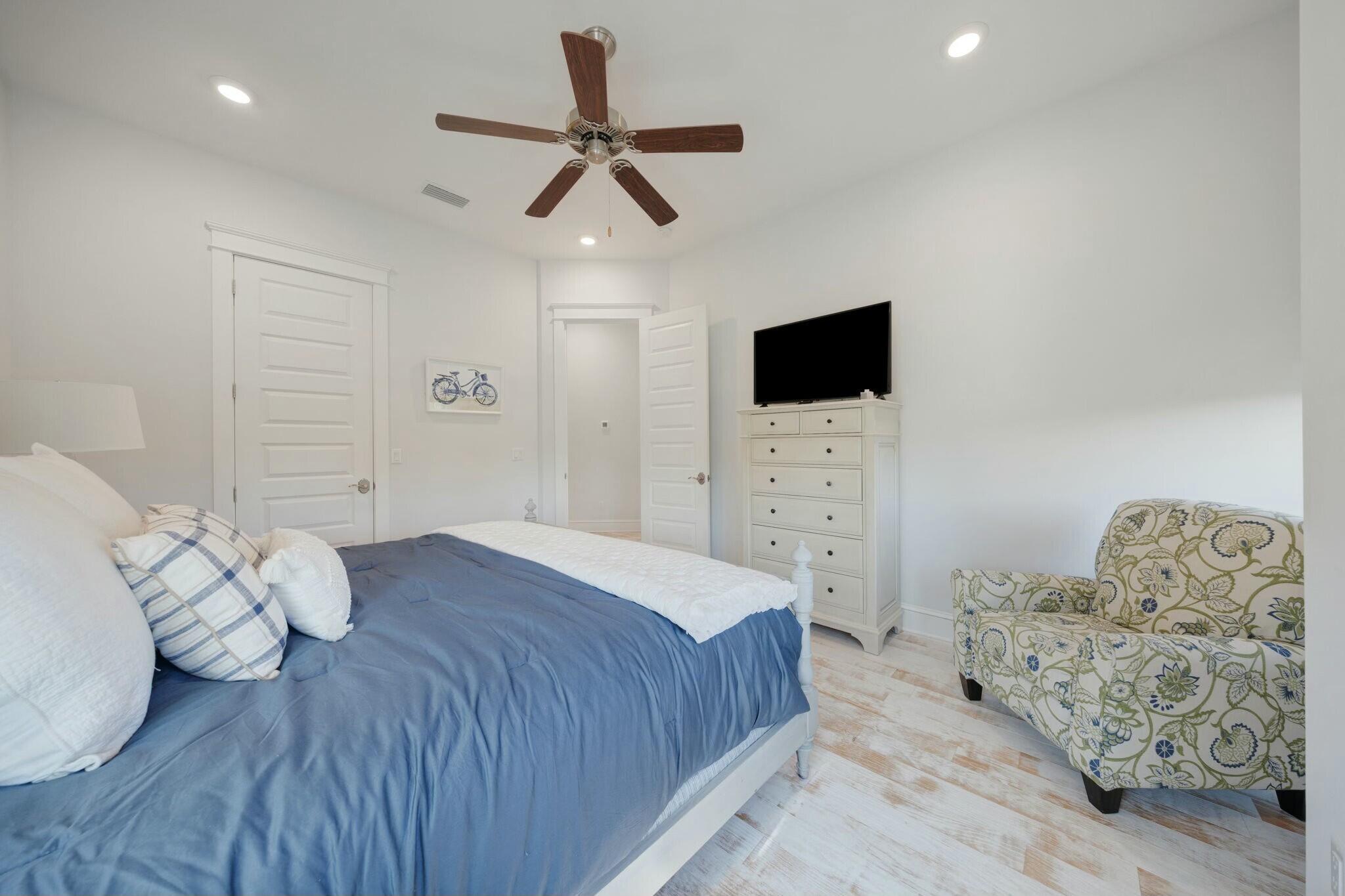 166 Clipper St Inlet Beach Inlet Beach, FL 32461 - Photo 35 of 71 a spacious bedroom with a bed and a flat screen tv