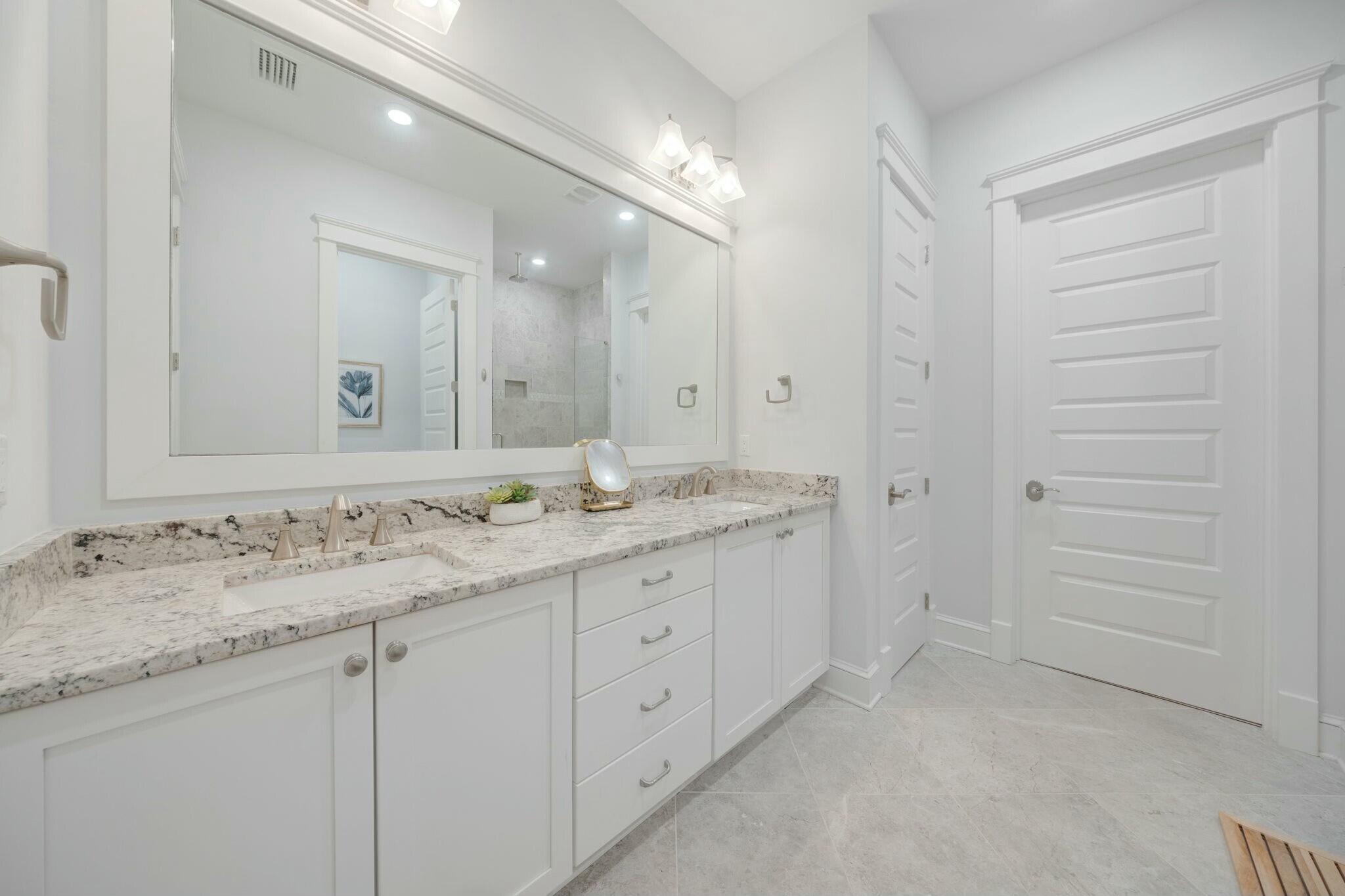 166 Clipper St Inlet Beach Inlet Beach, FL 32461 - Photo 43 of 71 a bathroom with a granite countertop sink two mirror and a