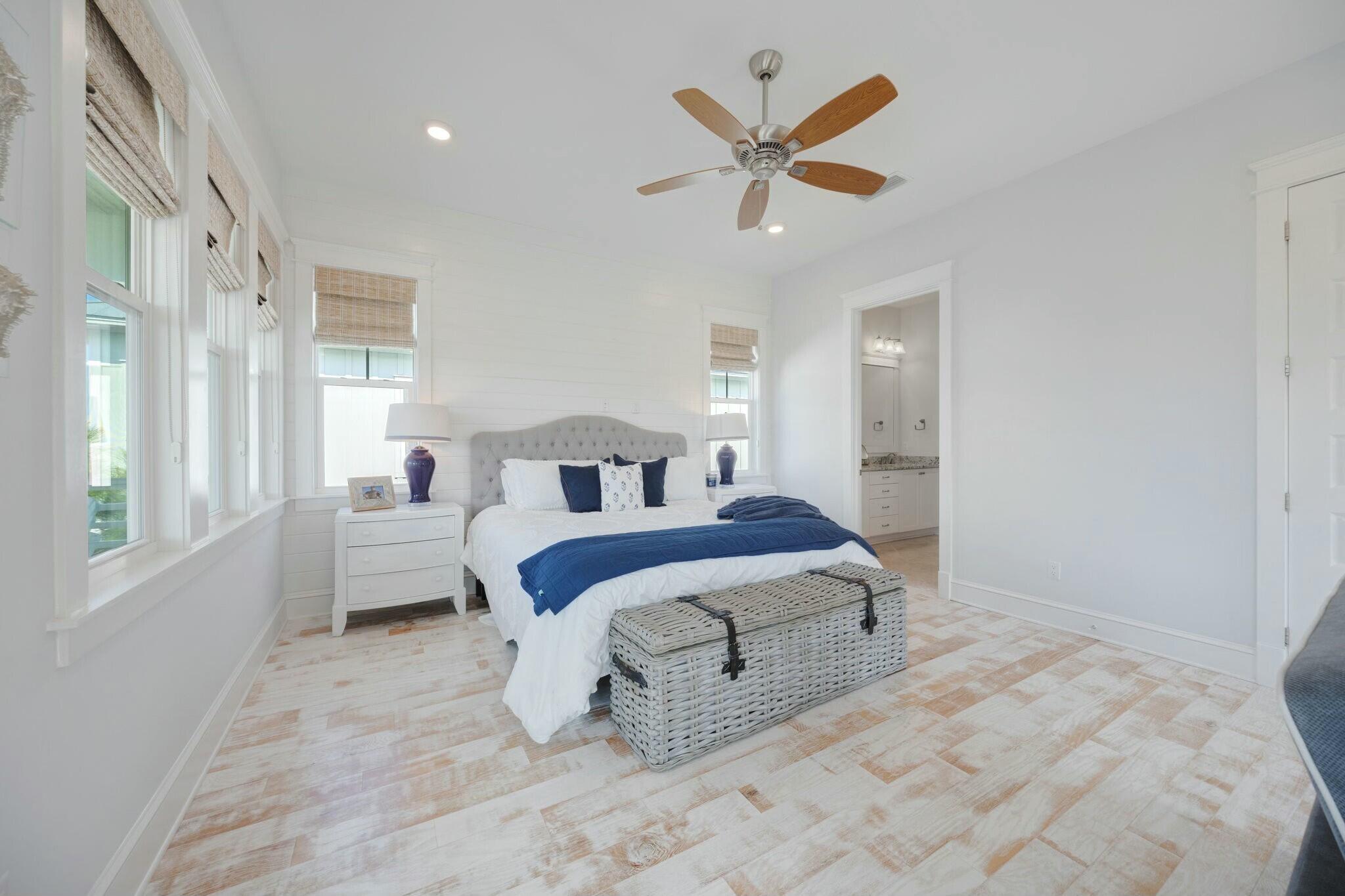 166 Clipper St Inlet Beach Inlet Beach, FL 32461 - Photo 44 of 71 a bedroom with a large bed and a chandelier