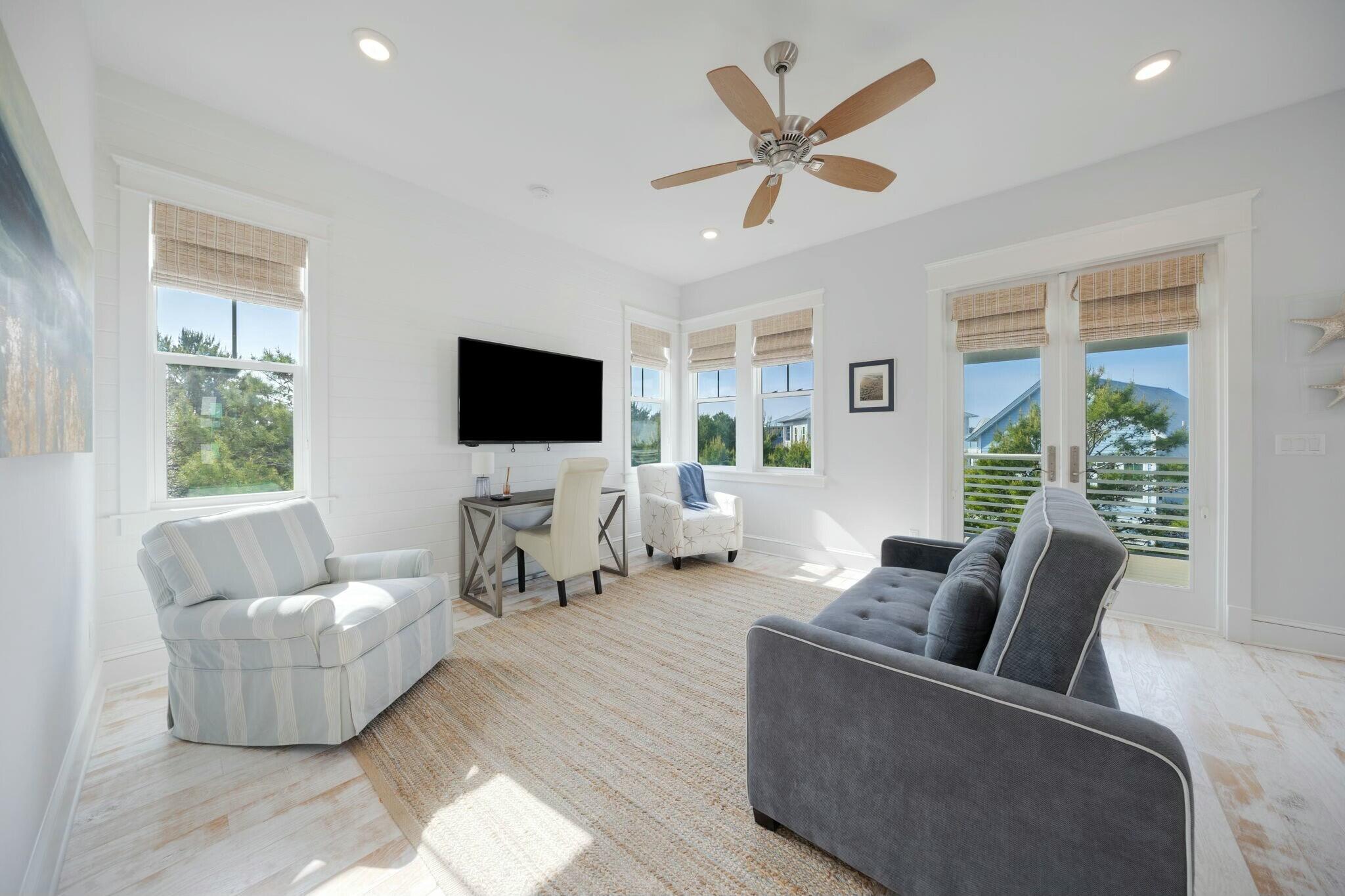 166 Clipper St Inlet Beach Inlet Beach, FL 32461 - Photo 46 of 71 a living room with furniture and a flat screen tv