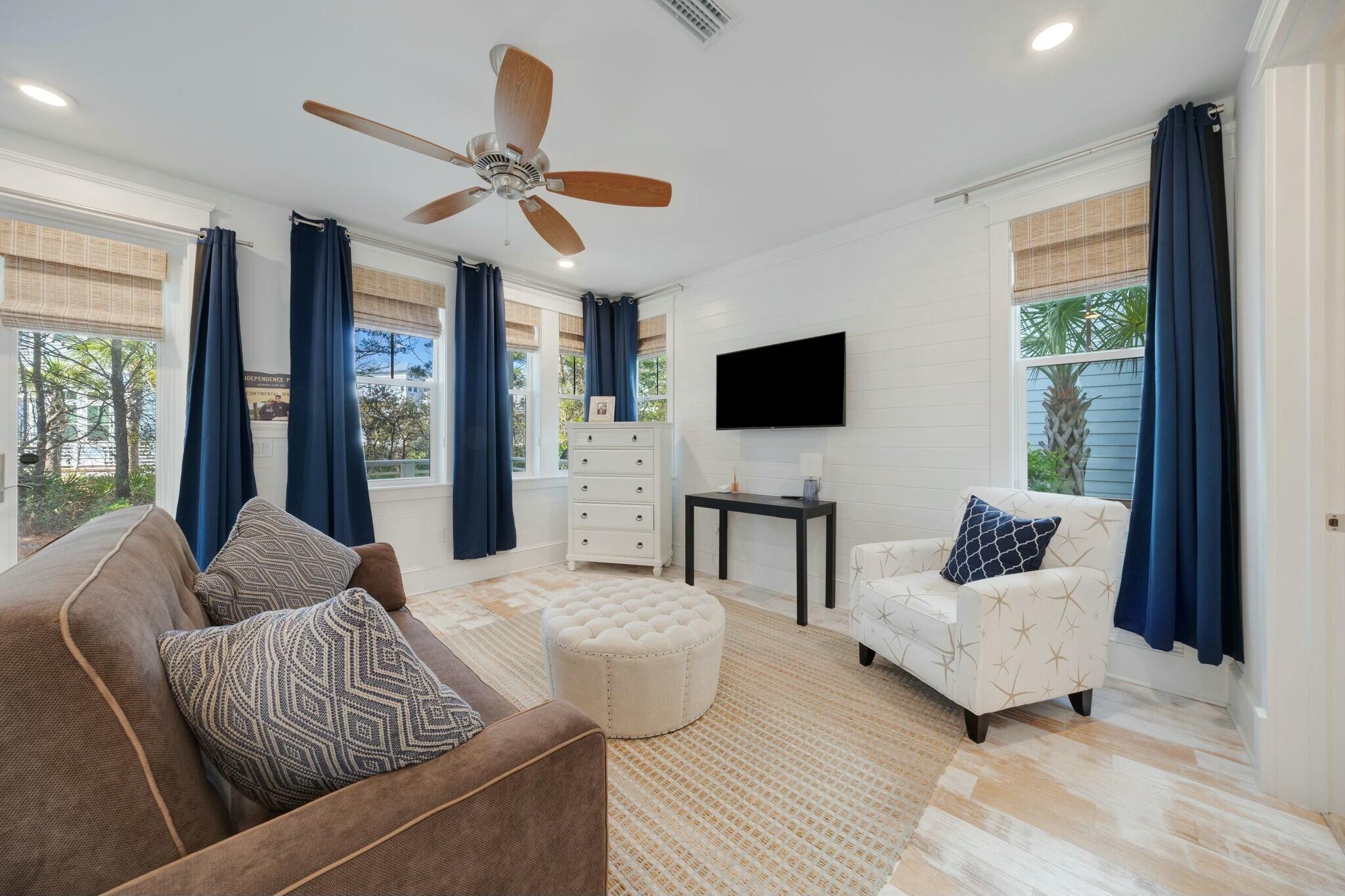 166 Clipper St Inlet Beach Inlet Beach, FL 32461 - Photo 50 of 71 a living room with furniture and a flat screen tv