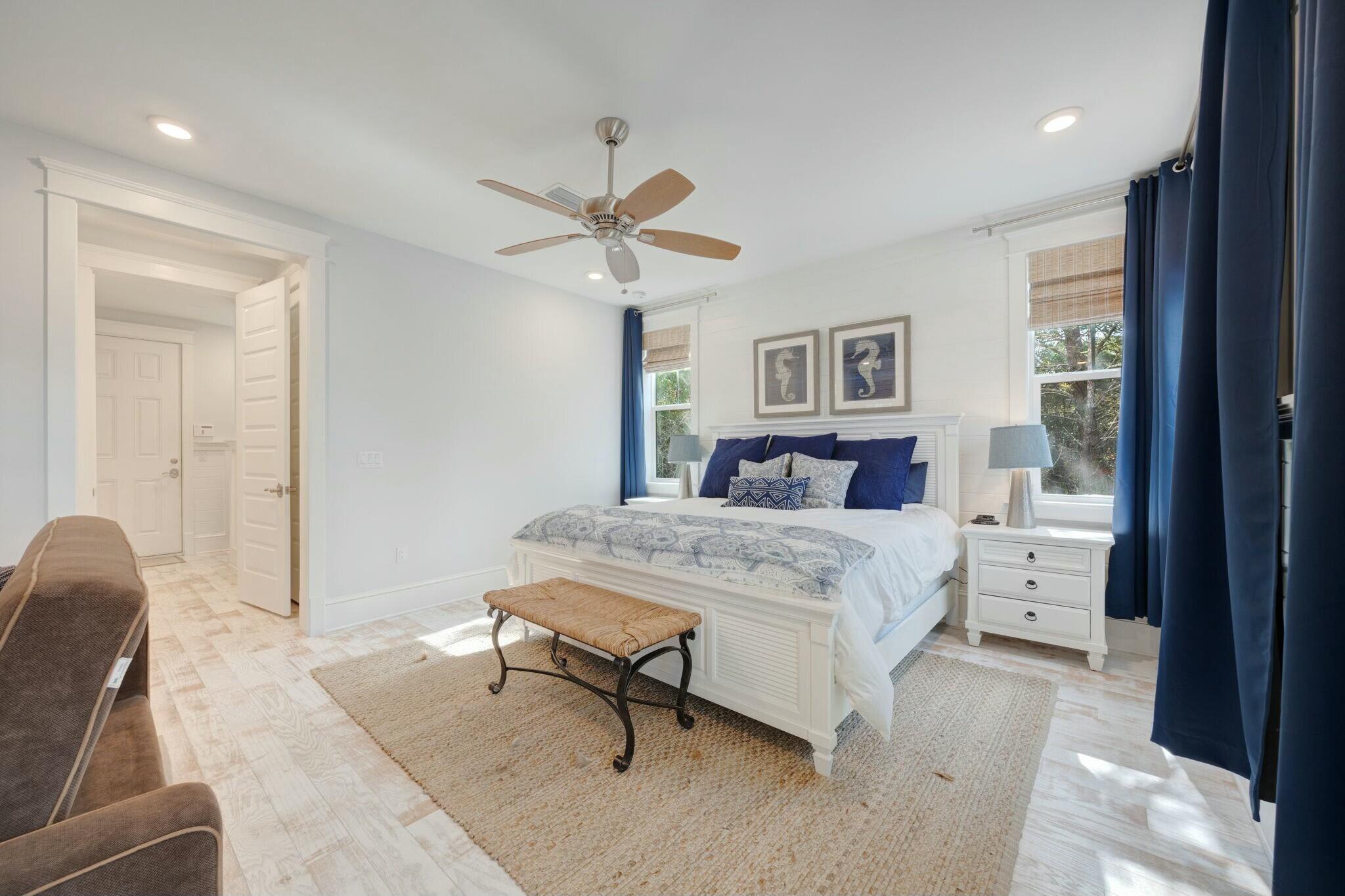 166 Clipper St Inlet Beach Inlet Beach, FL 32461 - Photo 51 of 71 a bedroom with a large bed and a chandelier