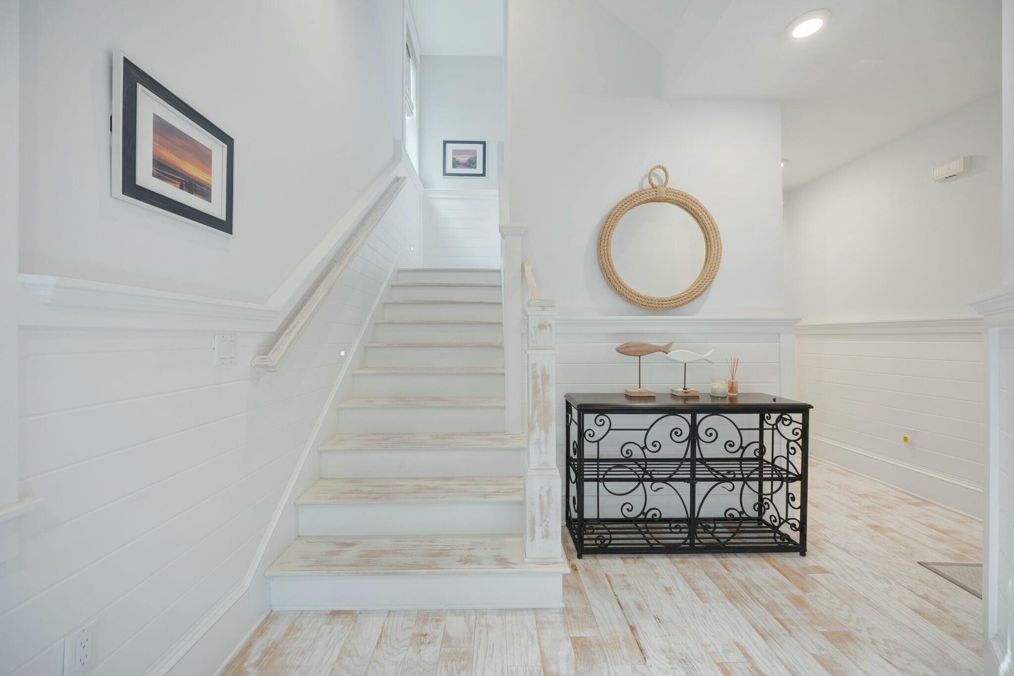 166 Clipper St Inlet Beach Inlet Beach, FL 32461 - Photo 56 of 71 a view of a hallway with wooden floor and staircase