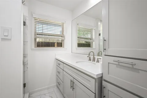 a bathroom with a sink and a vanity