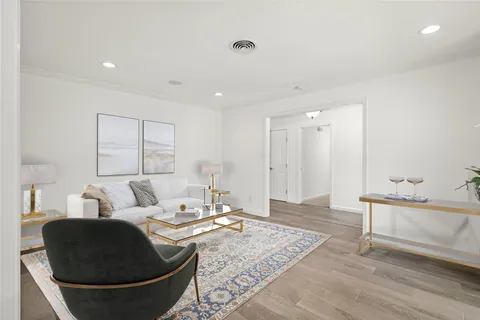 a living room with furniture and a rug