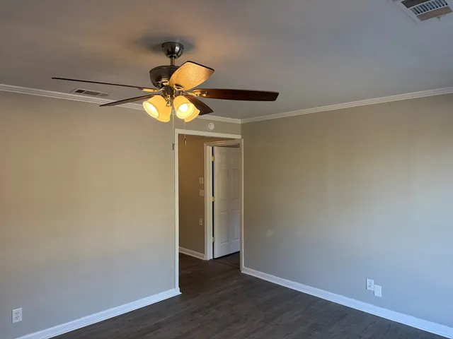 a view of a garage with wooden floor