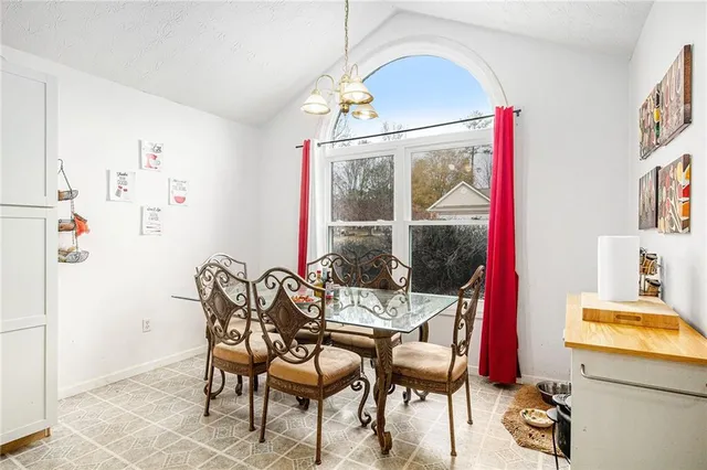 a kitchen with a sink cabinets and window