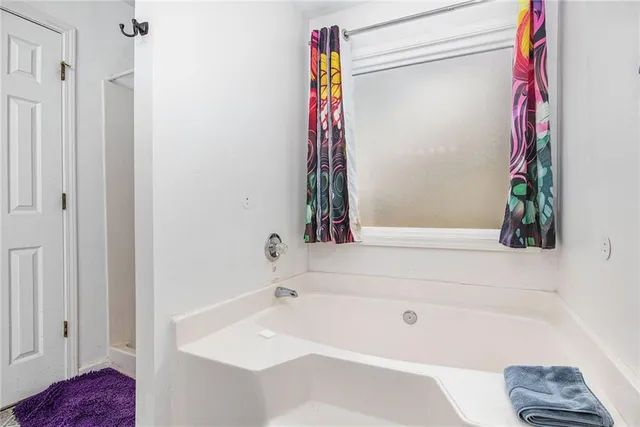 a bathroom with a sink vanity and a mirror