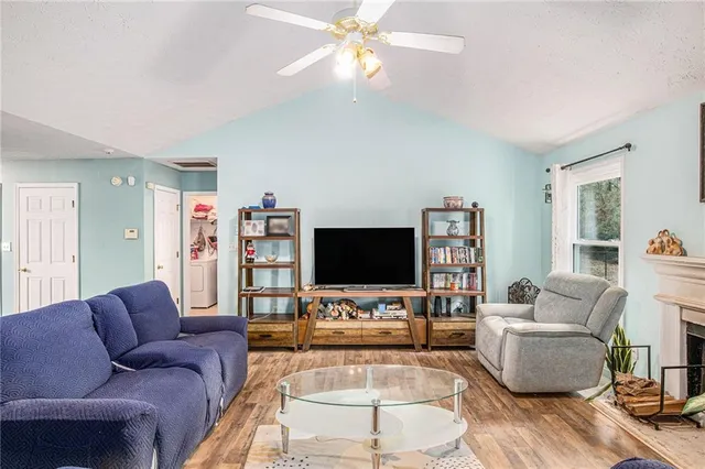 a living room with furniture and a flat screen tv