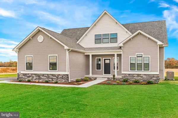 a front view of a house with yard