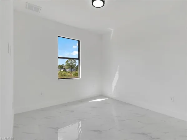 an empty room with windows