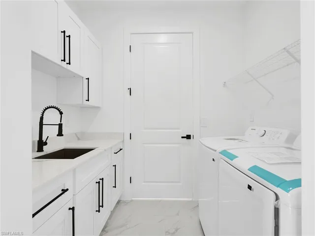 a spacious bathroom with a sink and a shower