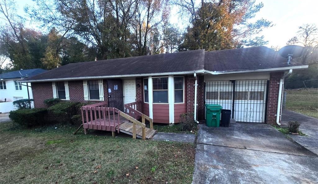 2527 Kelly Lake Road Decatur, GA 30032 - Photo 1 of 1 a front view of a house with garden