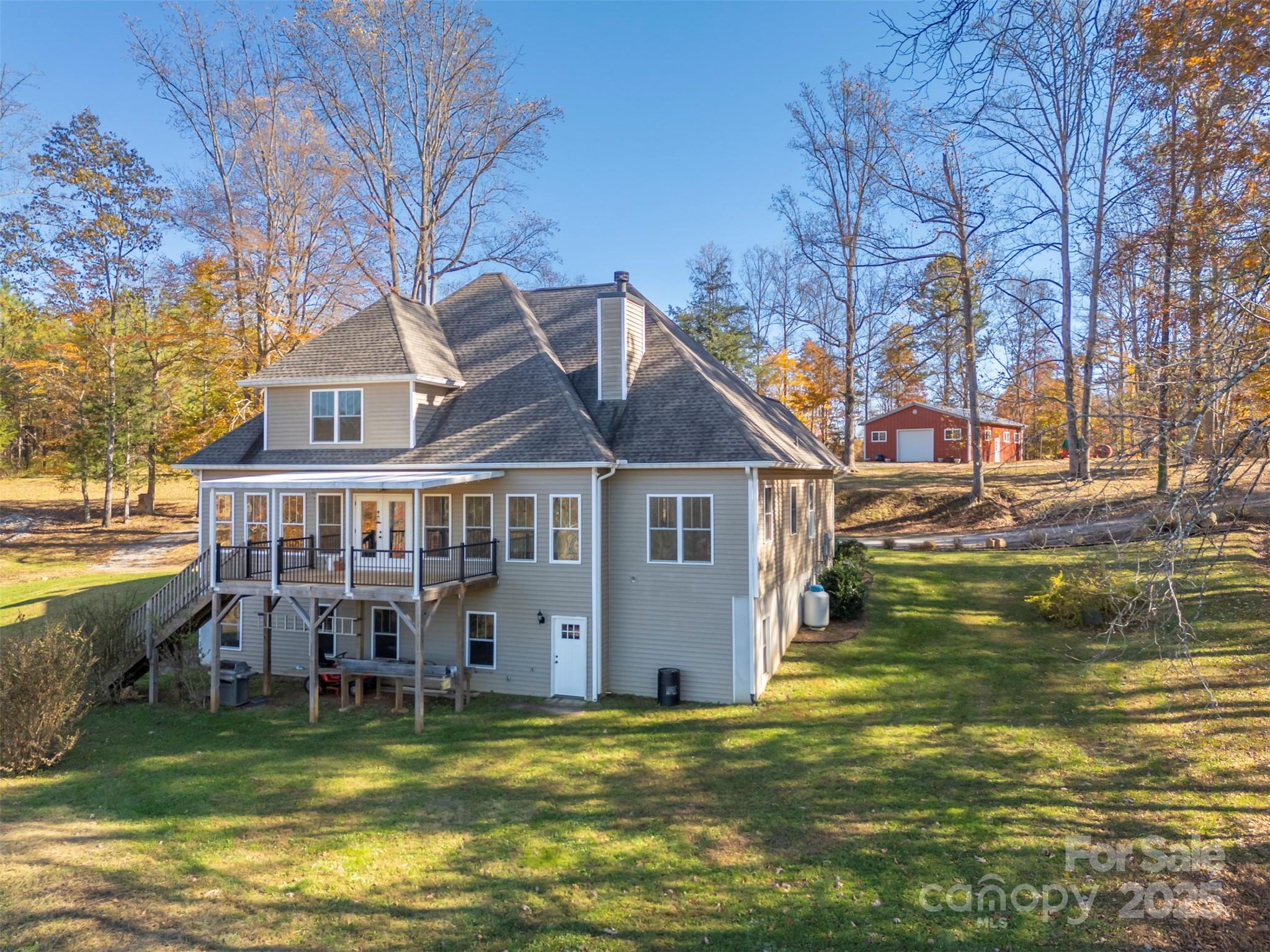 10105 Highway 108 Mill Spring, NC 28756 - Photo 3 of 44 a view of a house with a swimming pool
