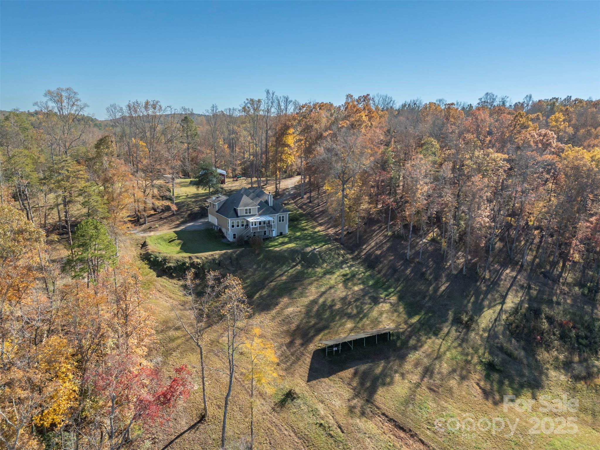 10105 Highway 108 Mill Spring, NC 28756 - Photo 39 of 44 a view of a houses with a yard