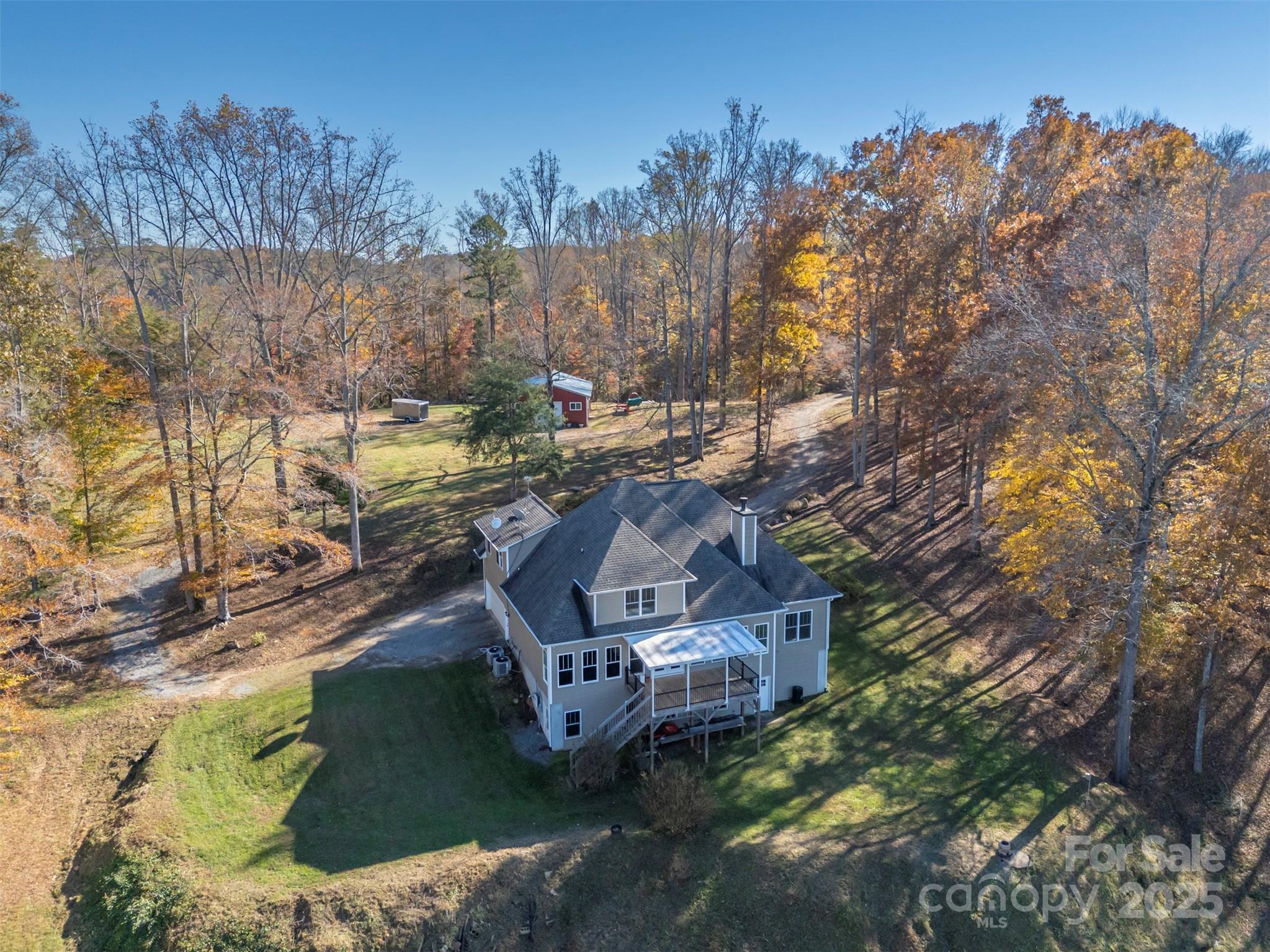 10105 Highway 108 Mill Spring, NC 28756 - Photo 40 of 44 a view of a house with a yard