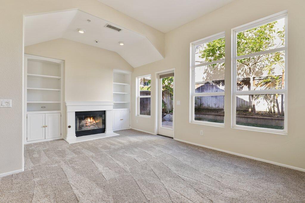 4695 Ellington Street Ventura, CA 93003 - Photo 17 of 43 an empty room with windows and fireplace