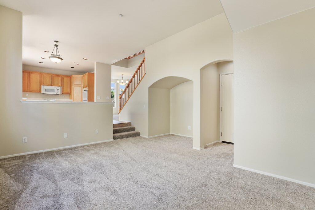 4695 Ellington Street Ventura, CA 93003 - Photo 19 of 43 an empty room with stairs and windows