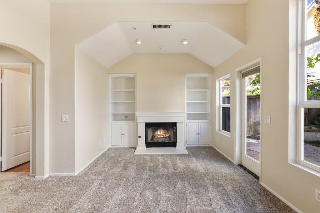 4695 Ellington Street Ventura, CA 93003 - Photo 21 of 43 an empty room with a fireplace and window